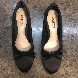 Black satin high heel shoes